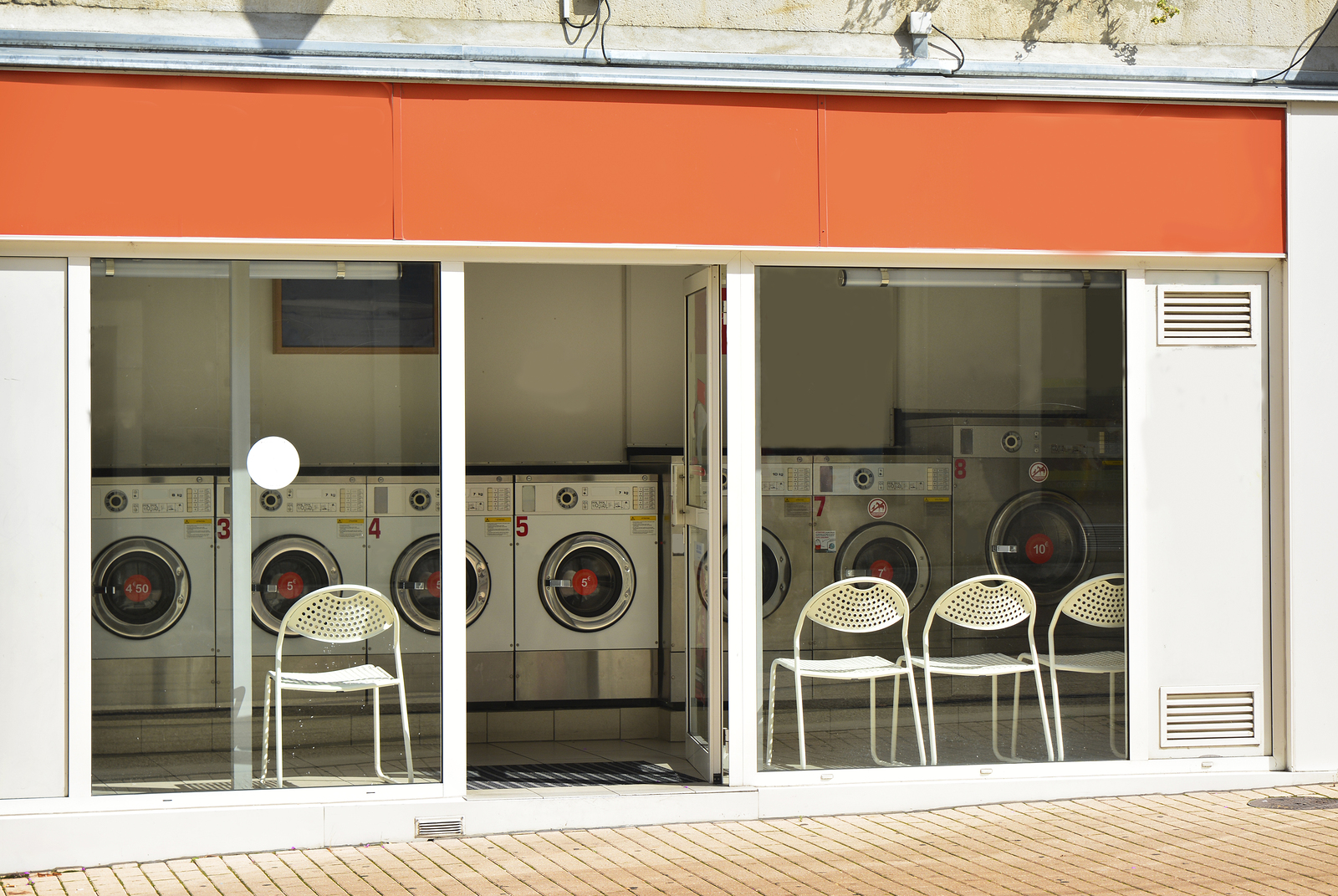 Coin laundry in a building in the city outside T & L EQUIPMENT SALES