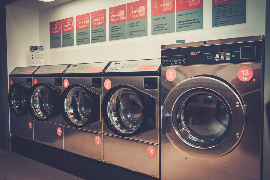 bigstock-Laundry-machines-at-laundromat-143670758.jpg